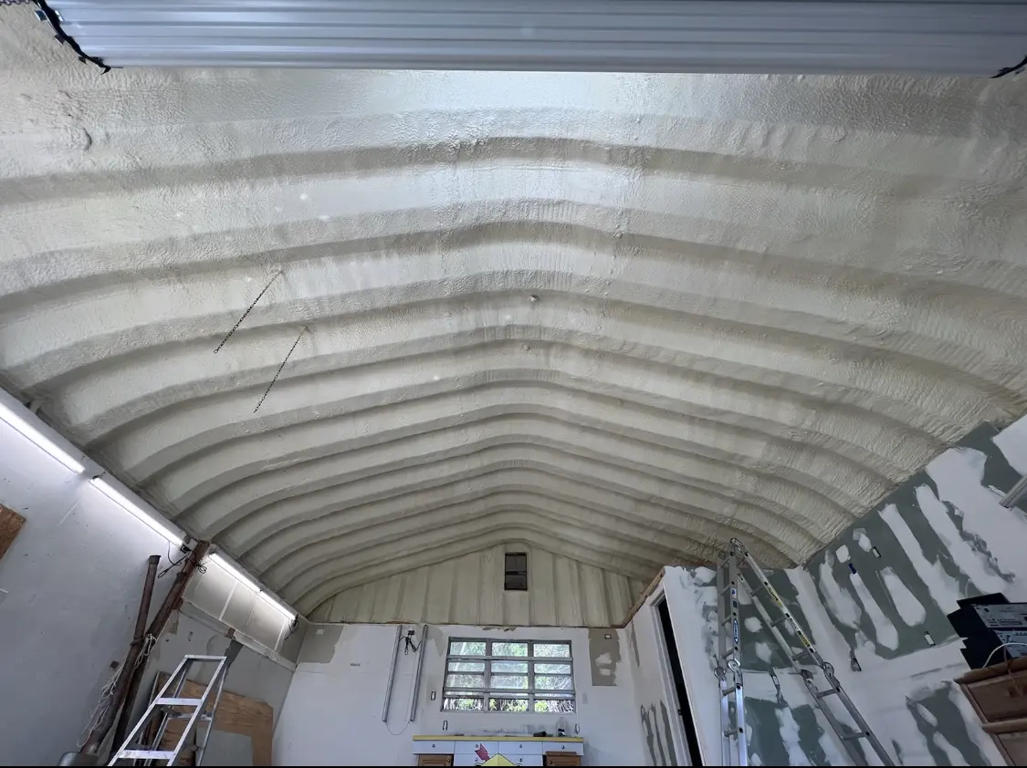 Spray polyurethane foam applied to the underside of a metal roof deck in Overlea
